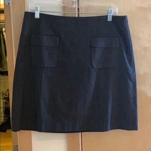 Dark grey skirt.